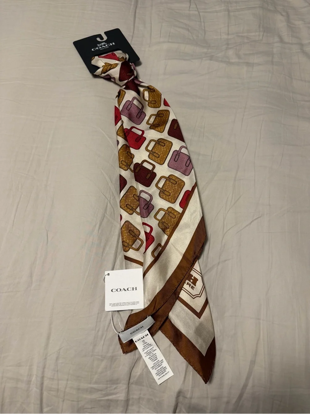 Coach Cream Scarf with Brown, Gold, Red and Pink Handbag Motif
